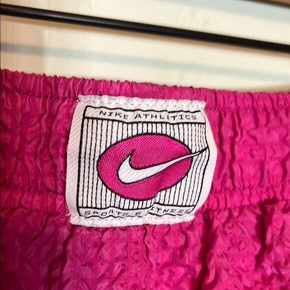 Nike Pink Lined Athletic Shorts with White Curved Hem and Elastic Waistband - Picture 2 of 4